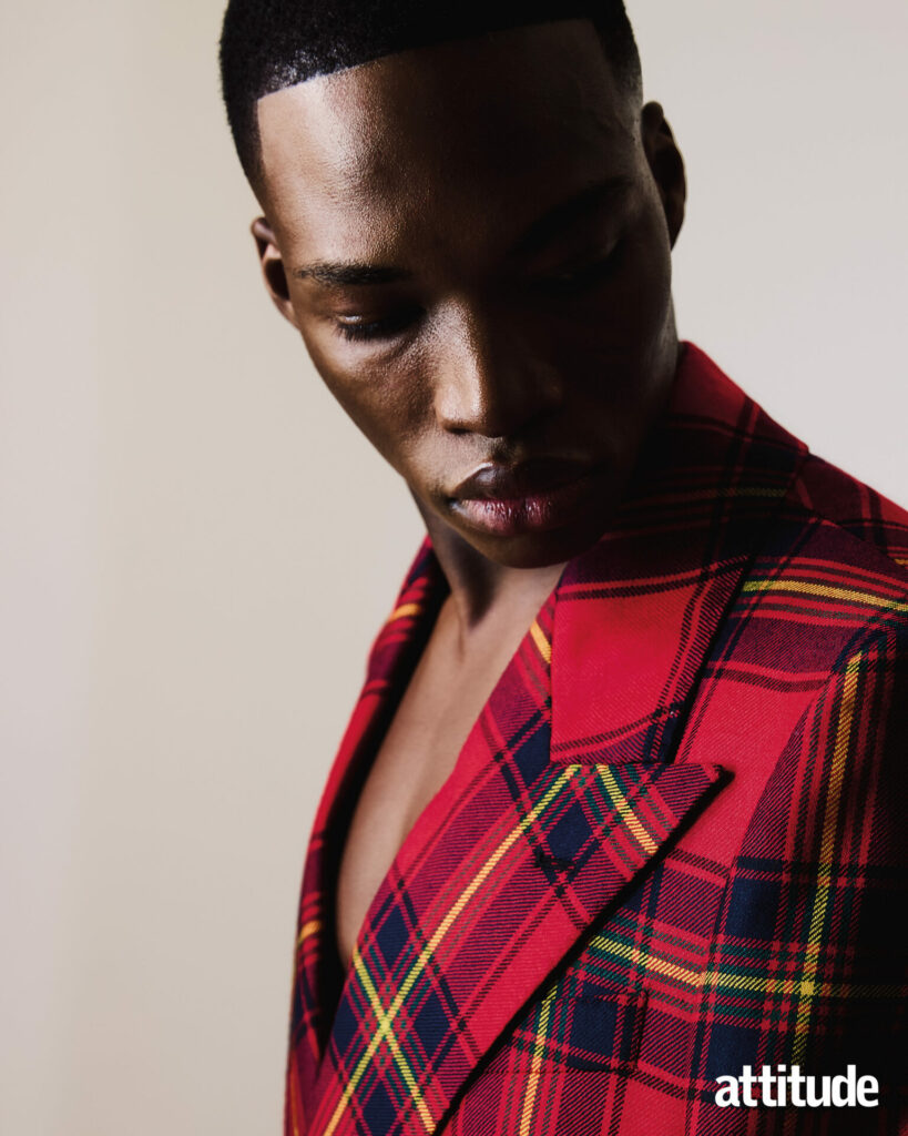 Close up shot of model in red plaid suit