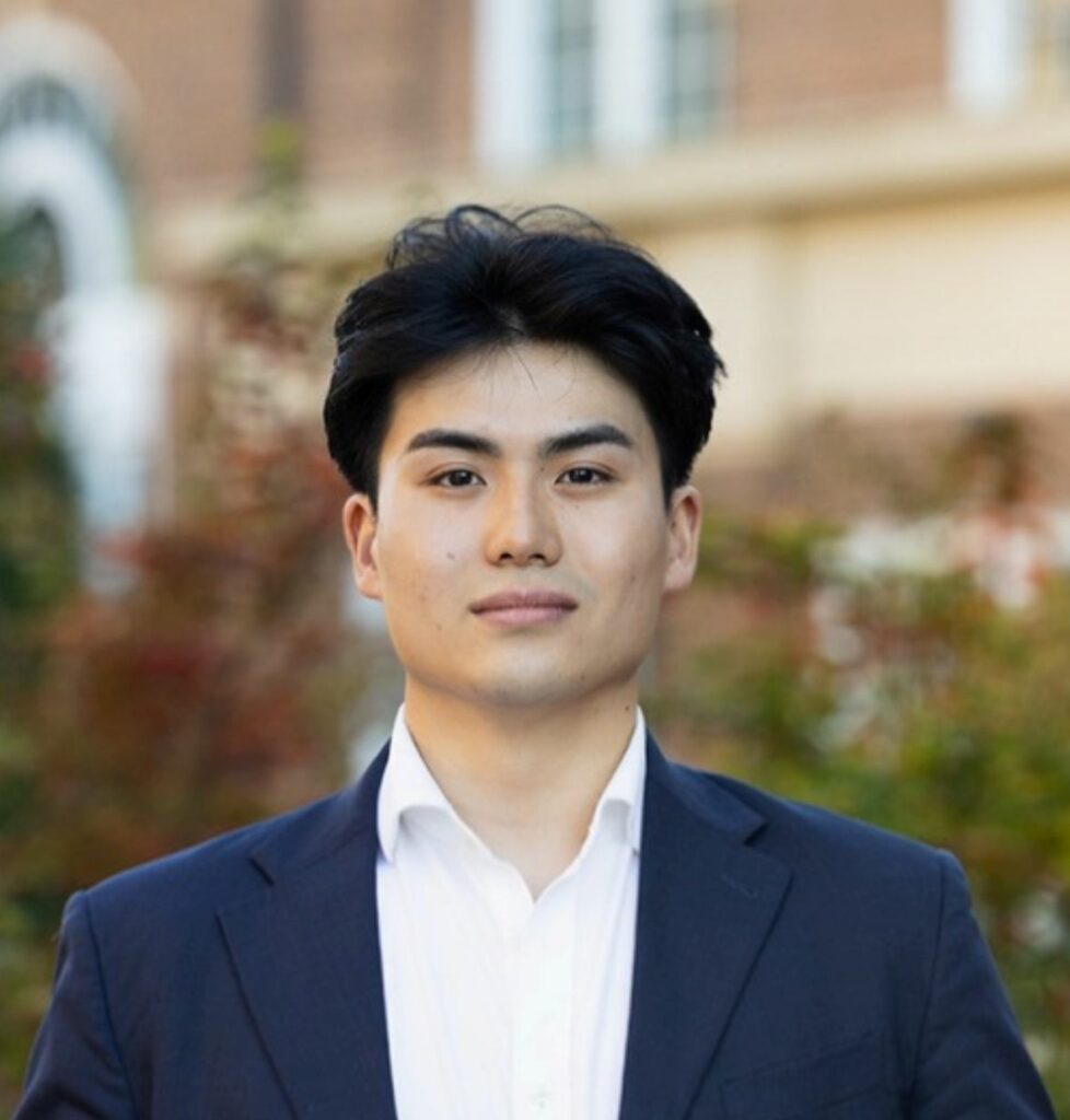 A smiling man in a blue suit