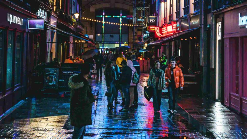 People on a street at night