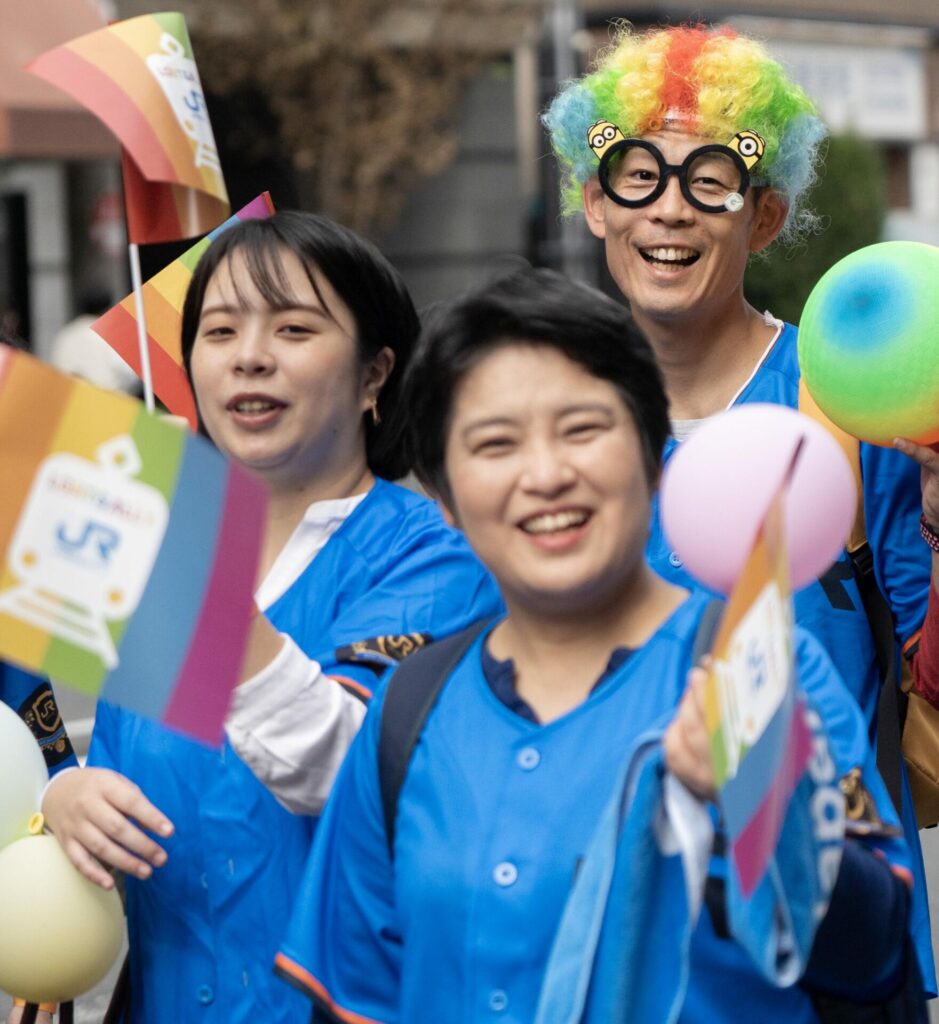 Japan Rail staff walking in the Pride march 