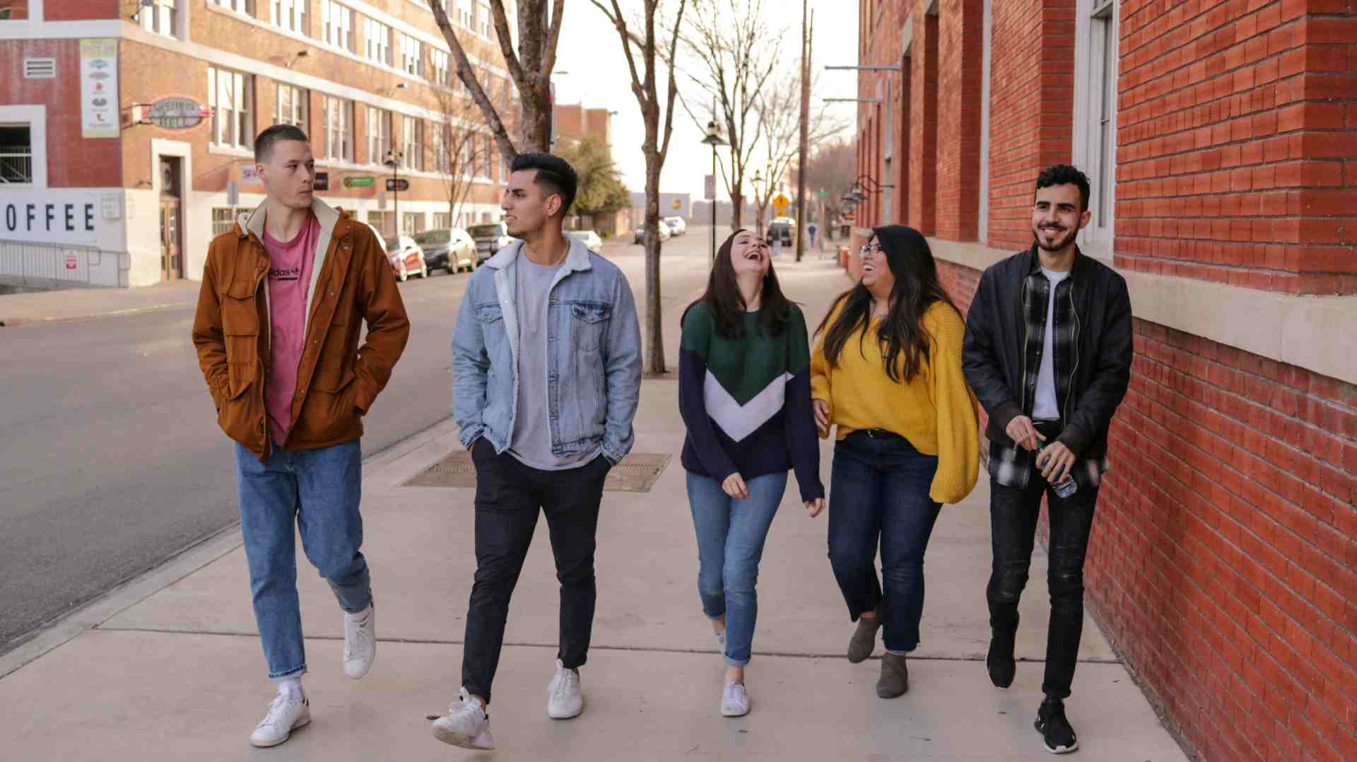 A group of friends walking down the street