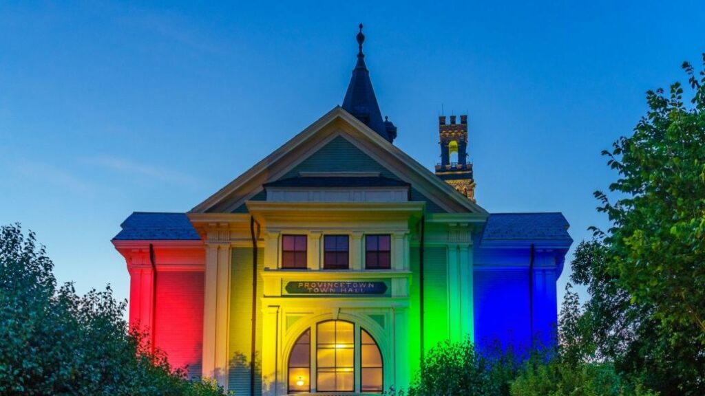 Provincetown town hall lit up with Pride colours