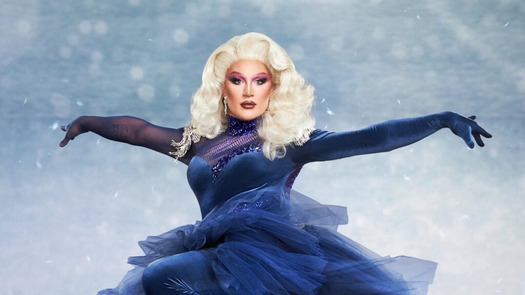 The Vivienne in a blue dress in a press shot for Dancing On Ice