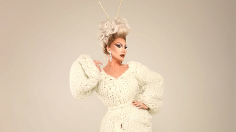 The Vivienne posing in a white wool number