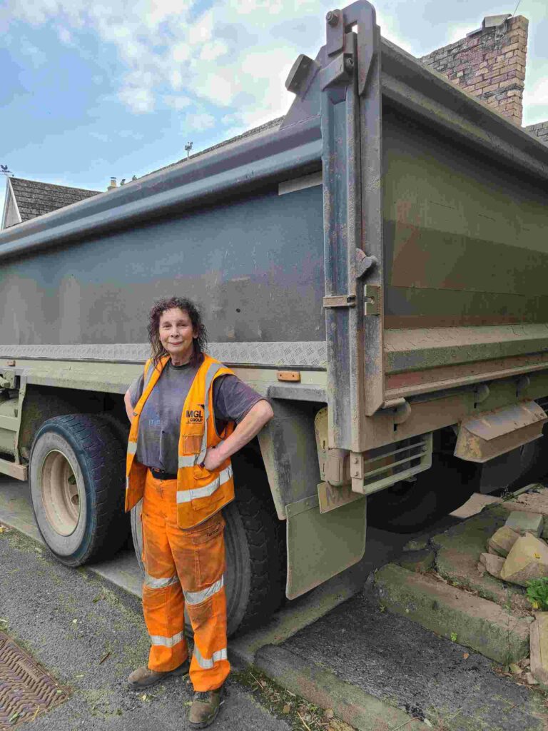 Yvonne Grey, who has battled her entire life to be recognised as a female, standing in front of a truck