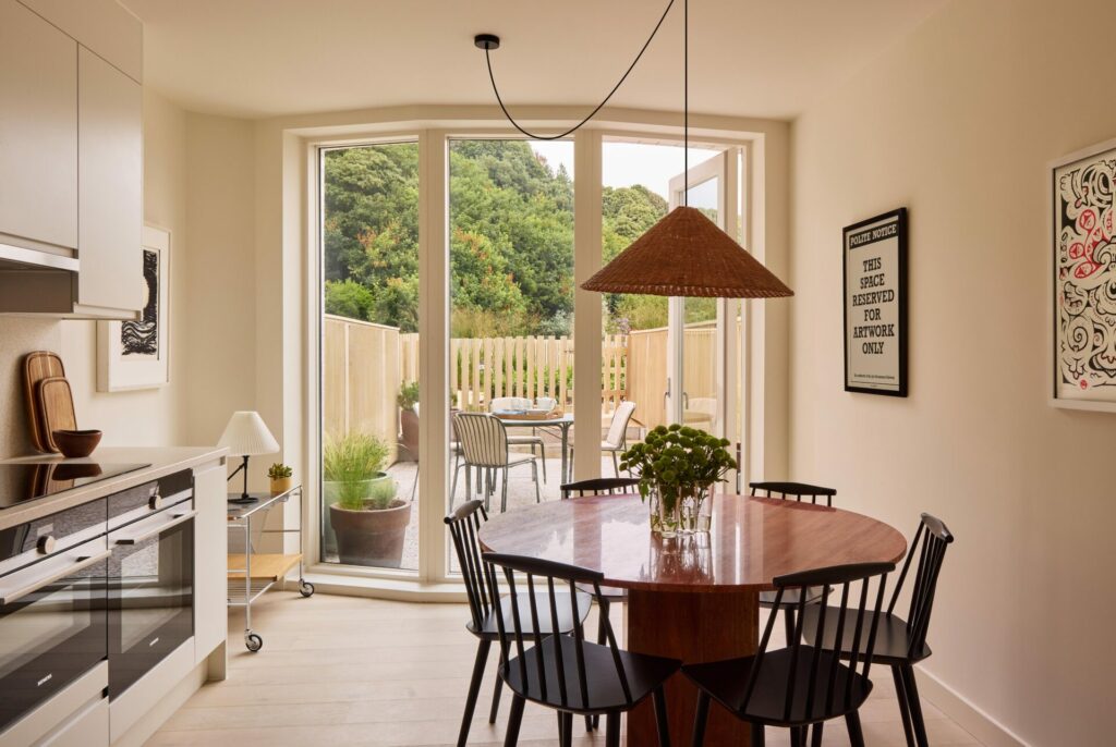 View of a kitchen/diner with furniture and a stove