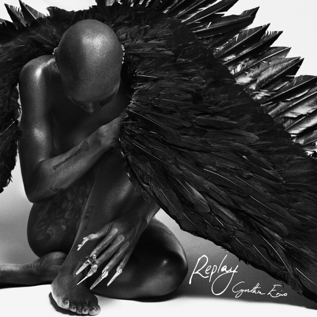 cynthia in black angel wings kneeling down