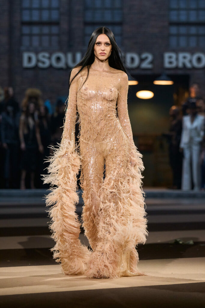 Amelia Gray wears sheer long sleeve sequin neutral dress with fur details