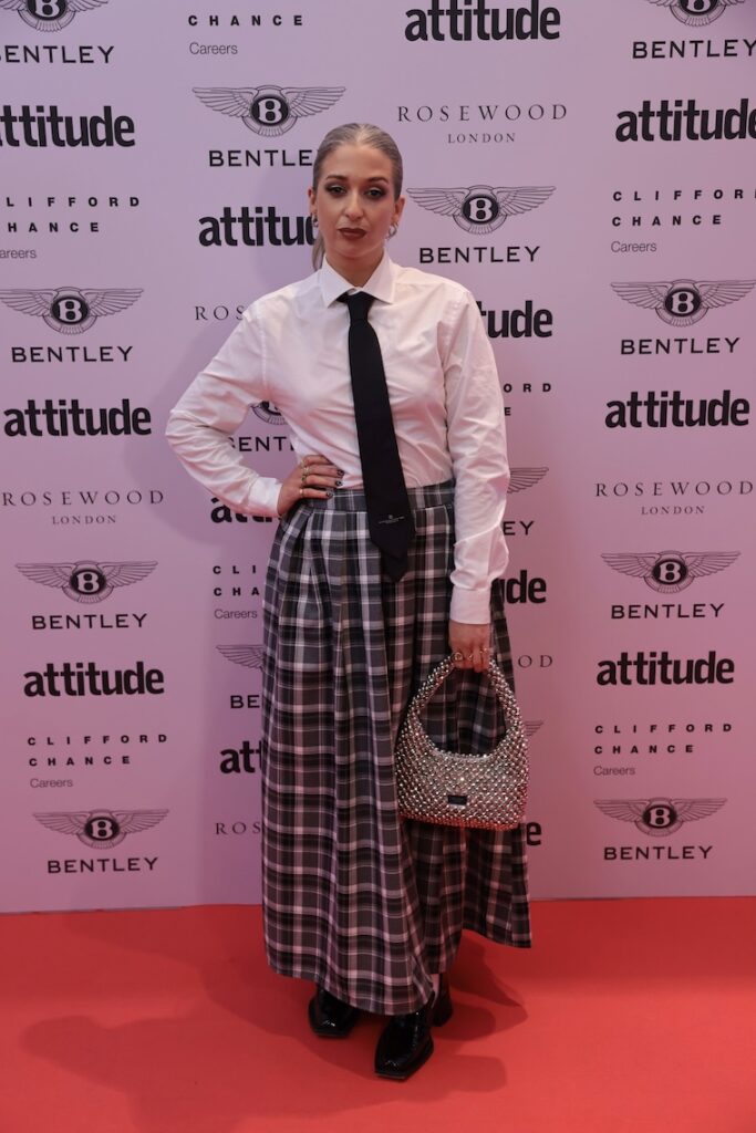 harriet rose in a shirt, tie and skirt