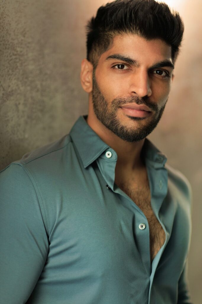 Neel Xaver in a blue-green shirt