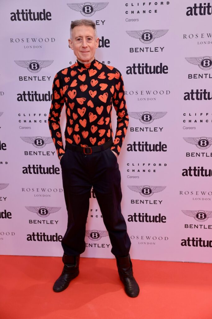 Peter Tatchell in a heat print jumper and black trousers on the red carpet