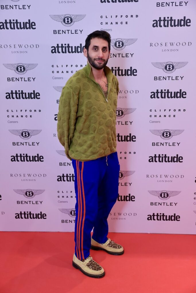 amrou in green top, blue sweatsuit bottoms