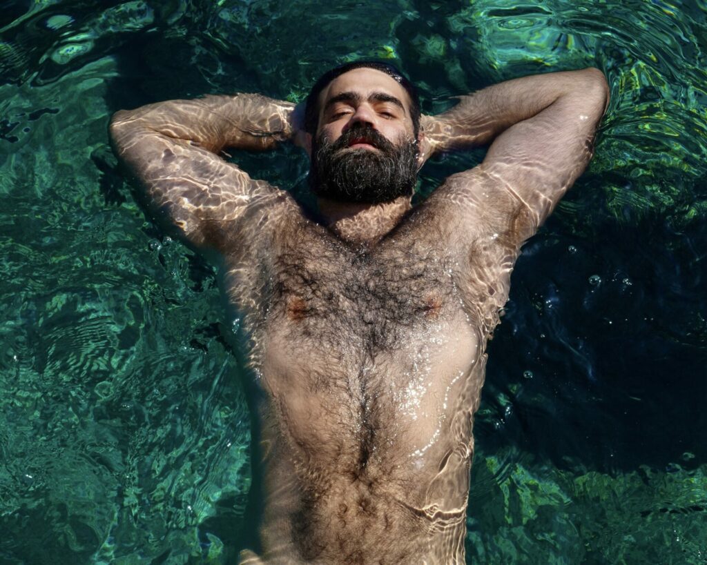 Portrait  shotof Yorgos Tsiantoulas floating in the ocean